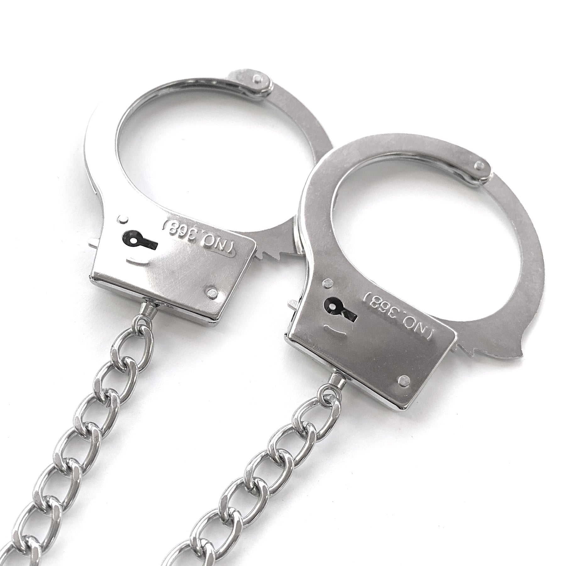 NIXIE Metal Butt Plug and Handcuff Set, Silver - THES